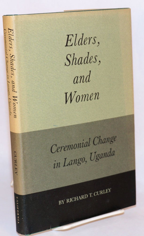 Cat.No: 107568 Elders, shades, and women; ceremonial change in Lango, Uganda. Richard T. Curley.