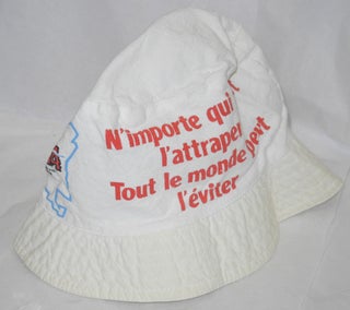 Cloth hat imprinted with the slogan; "N'Importe qui peut l'attraper, tout le monde peut l'eviter" roughly translates as [Anyone can catch it, everyone can avoid it]