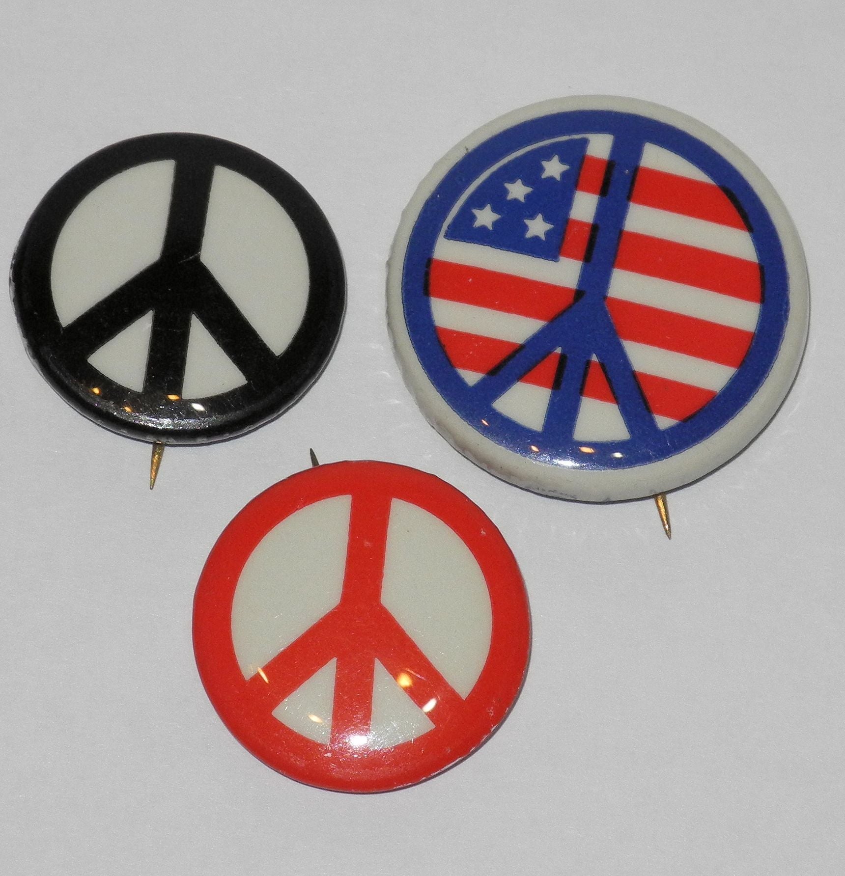Pin Back Signs Three peace sign pinback buttons