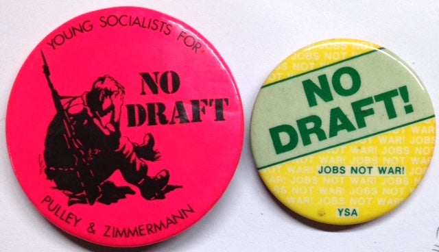 Cat.No: 203359 No draft [pinback button], together with Young Socialist Alliance "No Draft! Jobs not War" pin. Young Socialists for Pulley and Zimmermann.