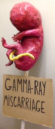Cat.No: 210709 Gamma-ray miscarriage [protest sign with papier maché sculpture in form...