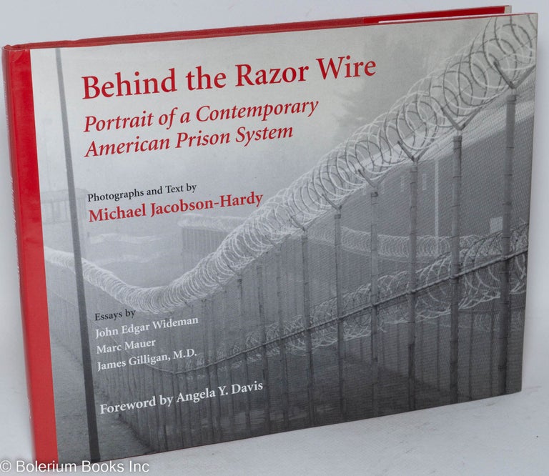 Cat.No: 46132 Behind the razor wire; portrait of a contemporary American prison system, foreword by Angela Y. Davis, essays by John Edgar Wiseman, Marc Mauer, and James Gilligan. Michael Jacobson-Hardy.